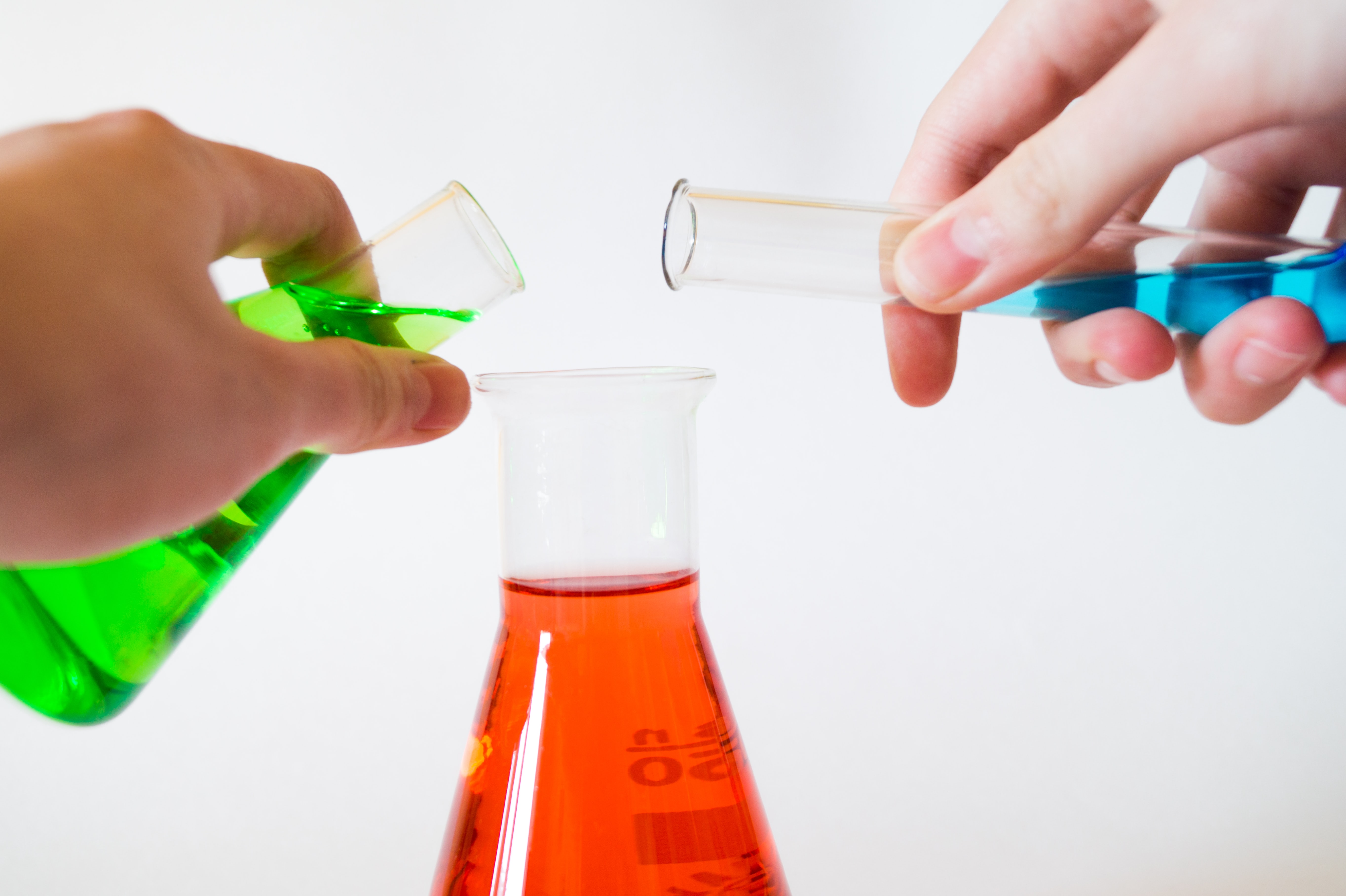 Colored liquids in glass flasks